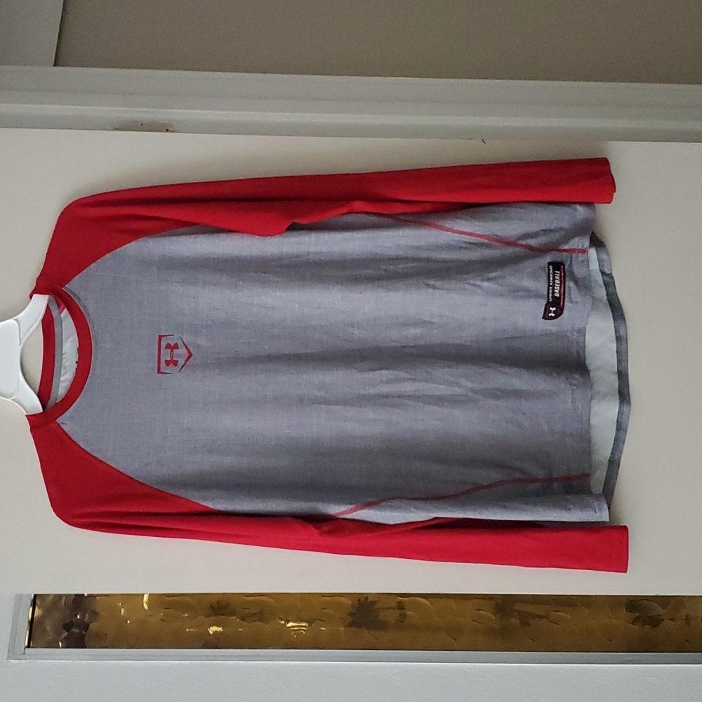 Under Armour baseball shirt.